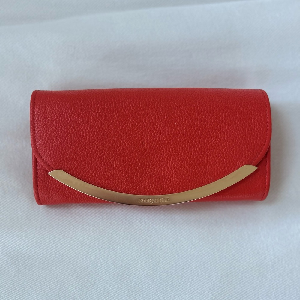 Brand new, never used. Orange/red, See by Chloe wallet.